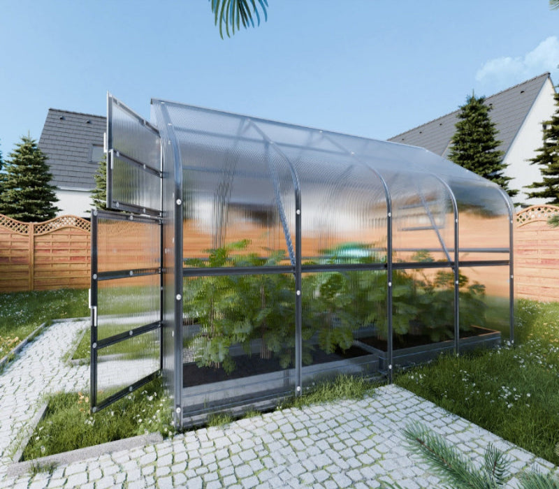 Greenhouse with plants in a backyard setting