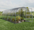 Greenhouse with plants on a grassy area